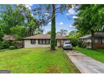 Charming, renovated single-story home with a well-maintained front yard and inviting curb appeal at 2835 Laguna Dr, Decatur, GA 30032