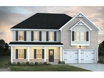Charming two-story home with a covered porch, two-car garage, and a well-manicured front lawn at 279 Overlook Rd # F7, Walnut Grove, GA 30052