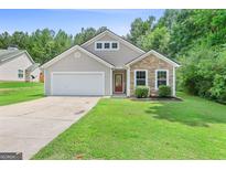 Charming single-Gathering home with a well-manicured lawn and a two-car garage at 107 Meadowbrook Ln, Grantville, GA 30220