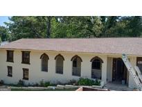 Charming exterior featuring a unique arched balcony and well-maintained facade at 6266 Auburn Dr, Riverdale, GA 30296