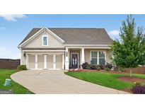 Charming single-story home with manicured lawn, three-car garage, and inviting front porch at 4160 Grandview Vista St, Cumming, GA 30028