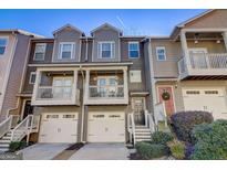 Charming townhome featuring a private balcony and an attached one-car garage at 1753 Liberty Pkwy, Atlanta, GA 30318