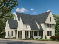 Beautifully designed two-story home with a charming facade, featuring a classic architectural style and mature landscaping at 100 Carlyle Ln, Fayetteville, GA 30214