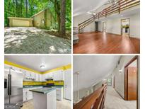 Exterior view showing the garage, driveway, and living room at 70 Juliana Dr, Ellenwood, GA 30294