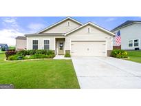 Charming one story home featuring a well-manicured lawn and a two-car garage at 3735 Westhaven Dr, Cumming, GA 30040