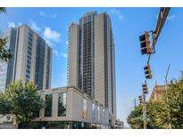 High-rise condominium building with an outdoor view and a cityscape setting against a vibrant blue sky at 1280 W Peachtreestreetsuffix=Street Nw # 808, Atlanta, GA 30309