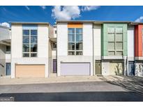 Modern townhomes featuring colorful accents and large windows for natural light at 1271 Mackintosh Nw Park # 30, Atlanta, GA 30318