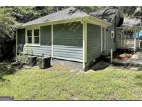 Charming exterior view of the home surrounded by lush greenery at 1914 North Nw Ave, Atlanta, GA 30318