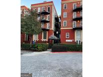 Attractive brick apartment building with balconies and well-maintained landscaping at 2840 Peachtree Road Nw Nw Rd # 306, Atlanta, GA 30305