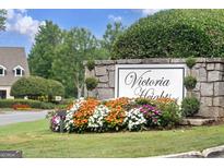 Stone community sign with manicured landscaping, reading 'Victoria Heights' at 5207 Santa Fe Pkwy, Sandy Springs, GA 30350