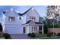 Beautiful new construction home features a two-car garage, covered porch and inviting curb appeal at 2606 Church Nw St, Atlanta, GA 30318