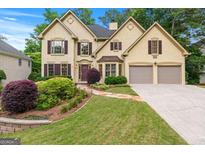 Beautiful two-story home with a well-manicured lawn and a two-car garage at 2864 Wyndcliff Ct, Marietta, GA 30066