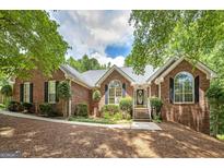 Charming brick home featuring a well-manicured lawn and inviting entrance perfect for a Gathering at 110 Chardonnay Oaks Dr, Mcdonough, GA 30252