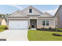 Charming single-Gathering home with a two-car garage and manicured front lawn at 280 Limestone Circle, Conyers, GA 30013