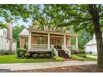 Charming brick home with a spacious front porch and manicured landscaping at 5130 Pratt Sw St, Covington, GA 30014