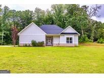 Charming single-story home with a well-manicured lawn and inviting entryway at 40 Westbrook Rd, Carrollton, GA 30116