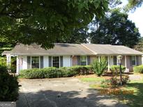 Charming single-story home with well-maintained landscaping and a welcoming front entrance at 3048 Haverford Se Ln, Marietta, GA 30067
