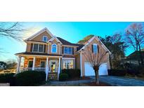 Charming two-story home featuring a blend of stone and siding, complemented by a well-manicured front yard at 190 Country Club Dr, Hiram, GA 30141