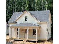 Charming two-story home featuring a welcoming front porch with white columns and a well-manicured lawn at 485 West Ave, Bowdon, GA 30108