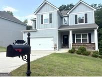 Charming two-story home with a well-manicured lawn and a classic mailbox, creating a welcoming curb appeal at 248 Webster Lake Dr, Temple, GA 30179
