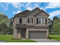 Charming two-story home featuring a brick front, gray siding, and attached two-car garage at 10422 Trellis Lane (Lot 38), Hampton, GA 30228