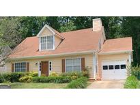 Charming one-story home with well-maintained landscaping and a cozy, inviting facade at 3232 Deer Pause Ln, Decatur, GA 30034