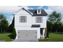 Charming two-story home featuring a gray garage door, complemented by a landscaped front yard and neutral-toned shutters at 4464 Eastbrook Pl # 56B, Snellville, GA 30039