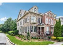 Attractive multi-story townhome with brick and siding exterior and well-manicured landscaping at 1278 Discover Green Lane Ln # 7, Mableton, GA 30126