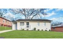 Charming one-story home with a well-maintained lawn and classic exterior at 70 Macon Se Pl, Atlanta, GA 30354