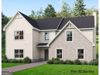 New construction two-story home with stone and siding, complemented by a well-manicured lawn at 125 Seymour Place, Fayetteville, GA 30214