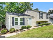 Charming home featuring manicured landscaping and classic architectural details, creating inviting curb appeal at 183 Wynnmeade, Peachtree City, GA 30269