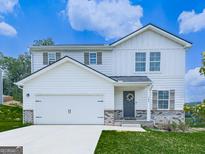 Charming two-story home with white siding, brick accents, two-car garage, and manicured lawn at 520 Pemberton St, Euharlee, GA 30145