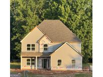 New construction two-story home with gray siding and a partially landscaped yard offers a great opportunity at 68 Maddox Road, Mcdonough, GA 30252