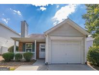 Charming single-Gathering home with a manicured lawn, one-car garage, and inviting front porch at 2375 Lexington Ln, Cumming, GA 30040