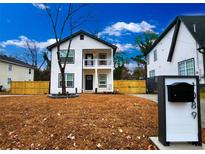 Charming two-story home with a welcoming front porch and manicured lawn, perfect for curb appeal at 1089 White Oak Sw Ave, Atlanta, GA 30310