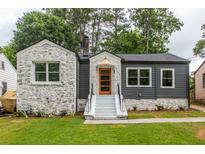 Charming craftsman home with white stone and gray siding at 1699 Olympian Sw Way, Atlanta, GA 30310