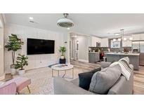 Cozy living room featuring stylish furniture, modern decor, and an open floor plan to the kitchen at 3182 Lake Ave, Atlanta, GA 30354