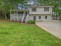Charming home with a cozy front porch, offering a welcoming entrance and curb appeal at 125 Enterprise Dr, Temple, GA 30179