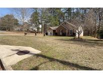 Charming single Gathering home with brick and siding exterior on a spacious lot at 5947 Rock Rd, Union City, GA 30291