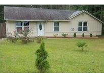 Cute ranch home with well-manicured lawn and updated landscaping at 158 Ashwood Ct, Riverdale, GA 30274