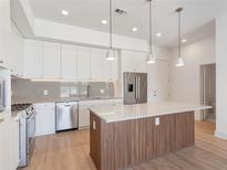 Modern kitchen with stainless steel appliances and an island at 675 Drewry Ne St # 205, Atlanta, GA 30306