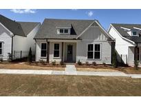 Charming single-story home featuring white siding, a gray roof, and a well-manicured lawn at 503 Godfrey Dr, Cumming, GA 30040