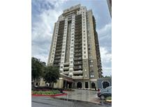 Contemporary high-rise condo building with private balconies and manicured landscaping at 795 Hammond Dr # 2007, Atlanta, GA 30328