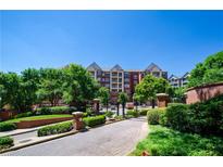 Gated community with mature trees and well-maintained landscaping provides an inviting entrance at 211 Colonial Homes Dr # 2304, Atlanta, GA 30309