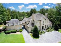 Luxury home with a large backyard, pool, and detached garage at 420 Windship Pl, Sandy Springs, GA 30327