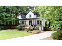 Charming two-story home featuring a well-maintained lawn and a welcoming front porch at 2868 Shillings Chase Nw Ct, Kennesaw, GA 30152