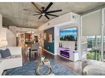 Bright living room featuring modern furnishings, sleek lighting, and an open floor plan at 3300 Windy Ridge Se Pkwy # 813, Atlanta, GA 30339