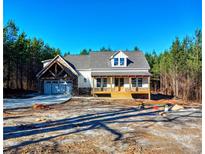 Craftsman style home with stone accents and a two-car garage at 136 Rainey Rd, Temple, GA 30179