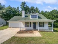 Charming single-story home with a well-maintained front yard and attached garage at 3384 Brookside Ln, Jonesboro, GA 30236