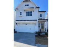 Two-story white house with a two-car garage and landscaping at 637 Skytop Dr, Cumming, GA 30040